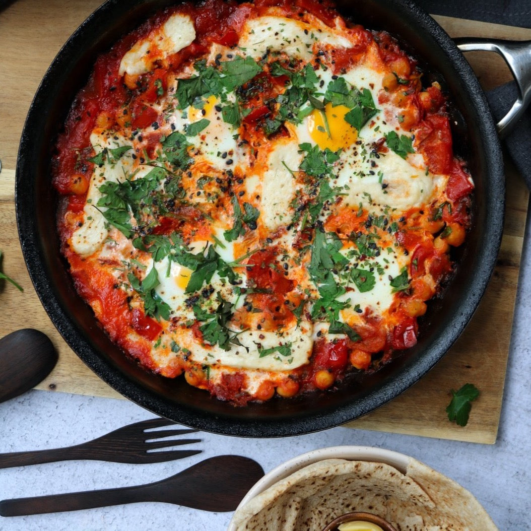 pan with shakshuka including Egg Master seasoning sprinkle