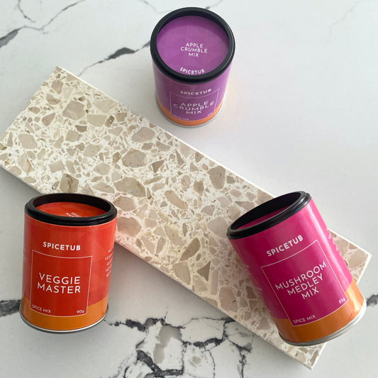 Three Spicetub containers on a marble surface
